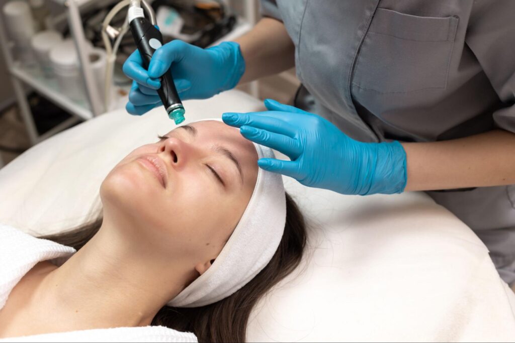 A client receiving a HydraFacial treatment to deeply cleanse and hydrate their skin, resulting in a glowing complexion.