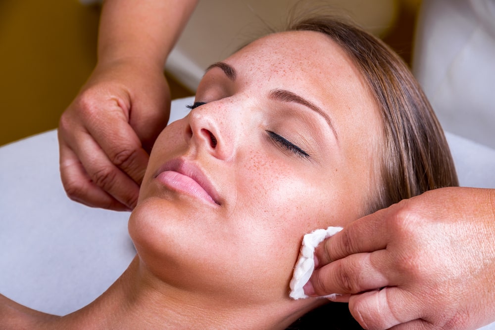 A patient undergoing preparation for a Laser Genesis treatment to rejuvenate facial skin.