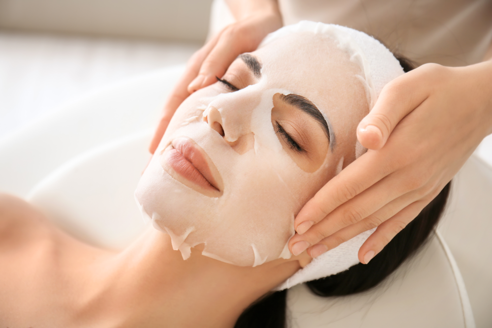 Woman receiving a med spa facial to treat hyperpigmentation and dark spots.